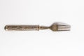 Antique metal rusty fork on a white background Royalty Free Stock Photo