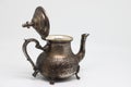 Antique metal teapot on a white background. Close-up of an old Arabic teapot. Royalty Free Stock Photo