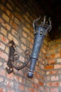 Antique metal torch holder on the wall