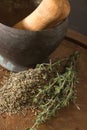 Antique metallic mortar with dried and fresh thyme.