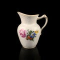 Antique milk jug with floral pattern Royalty Free Stock Photo