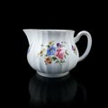 Antique milk jug with floral pattern. Royalty Free Stock Photo