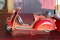 Antique miniature red toy diecast tricycle scooter with German helmet on back