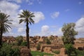 Antique Moroccan Kasbah Tamnugalt surrounded by palm