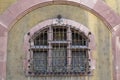 Antique multi-colored window with decorative lattice