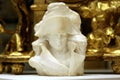 Antique Napoleon marble bust on golden decorative backgroung
