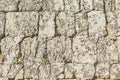 Antique natural stonewall.Background of ancient brick wall. Texture of old amphitheater stone for design.Layered rocks on a house Royalty Free Stock Photo