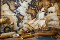 Antique Nautical Equipment with Ship Model and World Map for Vintage Maritime Decor Theme Royalty Free Stock Photo