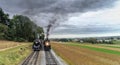 2 Antique Norfolk and Western Steam Engines Steaming up Side by Side Puffing Black smoke and Steam