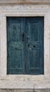 Antique old blue-green wood door with origin doorknocker Royalty Free Stock Photo