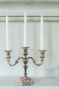 Antique old candlestick with white candles interior for home and living architecture retro style decoration