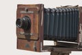 Antique old photo camera isolated on light background Royalty Free Stock Photo
