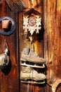 Antique old style retro object assemblage on a wooden wall. rustic stile. Clock, bell, old skates and others.
