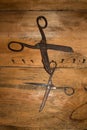 Antique old style retro object assemblage on a wooden wall scissors. Background.