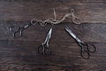 Antique old vintage retro scissors with thread on wooden table Royalty Free Stock Photo