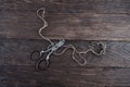 Antique old vintage retro scissors with thread on wooden table Royalty Free Stock Photo