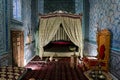 An antique oriental-style bed inside room of the palace. the room of the concubine or wife of the khan of the Khorezm