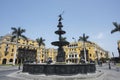 Antique Ornamental pool in Lima main square Peru.esculture in bronze background municipity facade