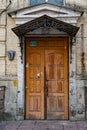 Retro building exterior. Doorway of house facade. Architectural details of stone building