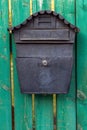 Antique outdoor mailbox on a fence