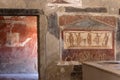 Antique painting art. Ancient fresco in tavern building in Pompeii, Italy. Beautiful retro decoration in roman kitchen ruins. Ital Royalty Free Stock Photo