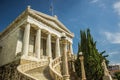 Antique palace complex facade with white walls and marble columns