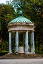 Antique park rome with columns and monuments a lot of greenery and sculptures marble