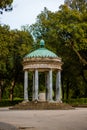 Antique park rome with columns and monuments a lot of greenery and sculptures marble