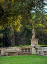 Antique park rome with columns and monuments a lot of greenery and sculptures marble