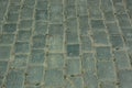 Antique paving stones. Grey boulders, old architecture, top view on the road