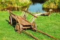 Antique Peasant Cart On Summer Lawn. Gardening And Housekeeping. Vintage Cart On Summer Sunny Day. Bright Sunny Day Royalty Free Stock Photo