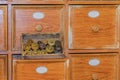 Antique pharmacy cabinet with small brass weights Royalty Free Stock Photo