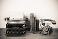 Antique phone and typewriter Royalty Free Stock Photo