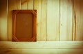 Antique photo frame on wooden table over wood background Royalty Free Stock Photo