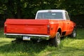 The antique pick-up truck is orange. Royalty Free Stock Photo