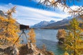 Antique plate camera on wooden tripod during a landscape photo Royalty Free Stock Photo