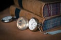 Antique pocket watch on leather with old books Royalty Free Stock Photo