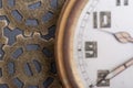 Antique pocket watch and old vintage hour metallic gears on natural stone Royalty Free Stock Photo