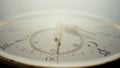 Antique pocket watch with a white dial and gold hands in bright light. The face of an old clock with numbers extra close Royalty Free Stock Photo