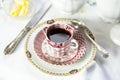 Antique porcelain breakfast setting with black cof