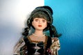 Antique porcelain doll with classic clothes