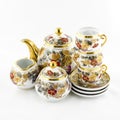 Antique porcelain tea and coffe set with flower motif Royalty Free Stock Photo