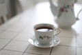 antique porcelain tea set on white background. cup of tea and a kettle on a table Royalty Free Stock Photo