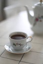 antique porcelain tea set on white background. cup of tea and a kettle on a table Royalty Free Stock Photo