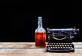 Antique Typerwriter and Whisky Bottle.