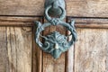 Antique pull handle knob on a vintage wooden door. Architectu