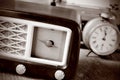 Antique radio, alarm clock and typewriter, in sepia toning