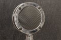 Antique Radio Microphone in chrome with black background. Stacked focus or Depth Compositing technique Royalty Free Stock Photo