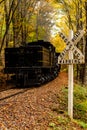 Antique Railroad Crossing Sign - Shay Steam Locomotive Climbs Grade in Autumn / Fall - Cass, West Virginia Royalty Free Stock Photo