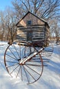 Antique rake and cabin in snow